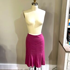DVF fuschia pink skirt flairs in back.